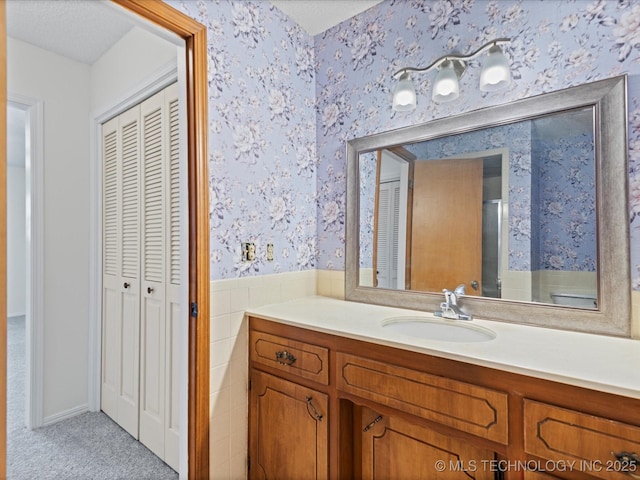 bathroom featuring vanity and a textured ceiling