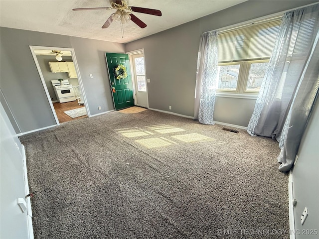 unfurnished bedroom with carpet floors, baseboards, visible vents, and a textured ceiling