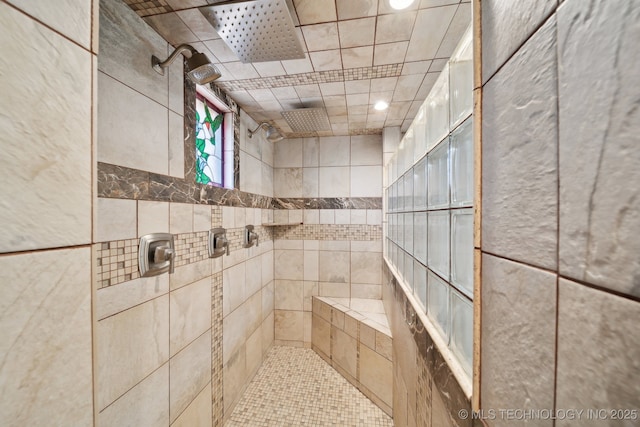 bathroom with tiled shower