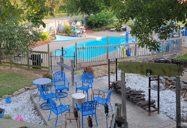 view of patio featuring a community pool