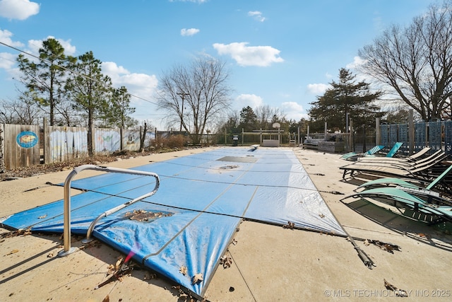 view of swimming pool with a patio