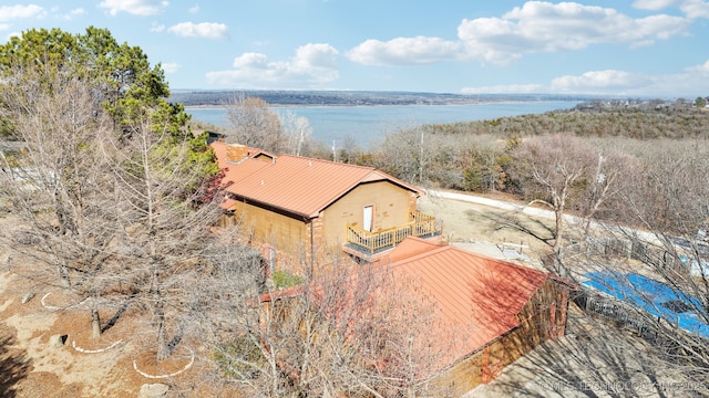 birds eye view of property with a water view