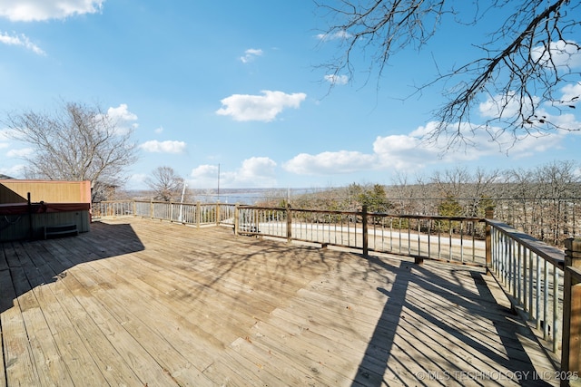 deck with a hot tub