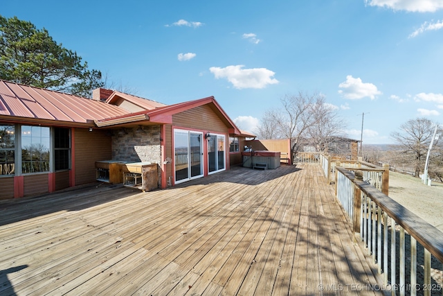 wooden terrace with a hot tub