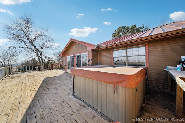 deck featuring a hot tub