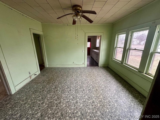 unfurnished room featuring ceiling fan