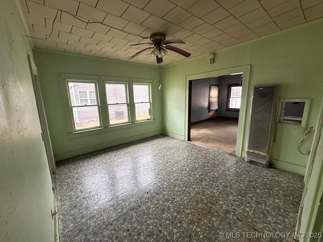 spare room with ceiling fan