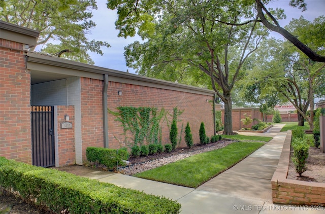 2411 E 72nd Pl Unit 2-A-3, Tulsa, OK 74136 - view of side of property featuring brick siding
