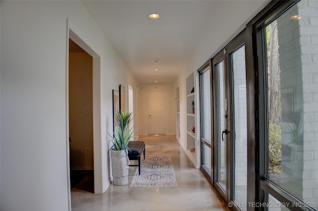 2411 E 72nd Pl Unit 2-A-3, Tulsa, OK 74136 - hall with concrete floors and recessed lighting