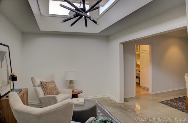2411 E 72nd Pl Unit 2-A-3, Tulsa, OK 74136 - living area with finished concrete flooring, a skylight, and a tray ceiling