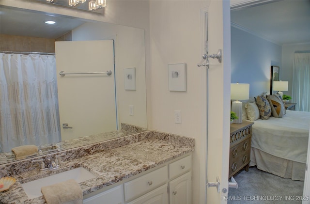 2411 E 72nd Pl Unit 2-A-3, Tulsa, OK 74136 - bathroom featuring vanity and ornamental molding