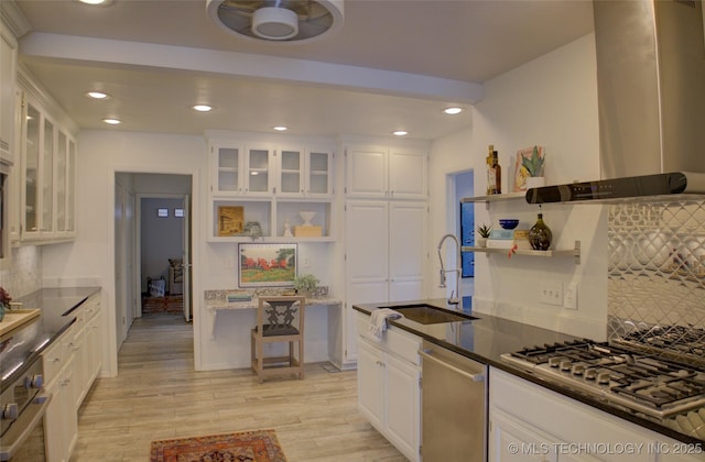 2411 E 72nd Pl Unit 2-A-3, Tulsa, OK 74136 - kitchen featuring wall chimney range hood, stainless steel appliances, white cabinets, open shelves, and recessed lighting