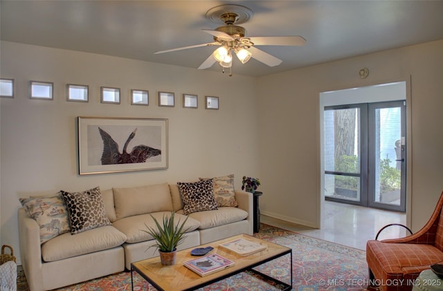 2411 E 72nd Pl Unit 2-A-3, Tulsa, OK 74136 - living area featuring baseboards and ceiling fan