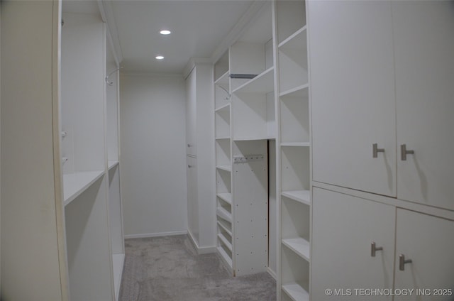 2411 E 72nd Pl Unit 2-A-3, Tulsa, OK 74136 - walk in closet with light colored carpet