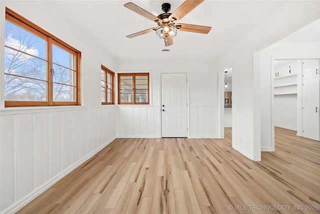 interior space with ceiling fan and light wood-type flooring