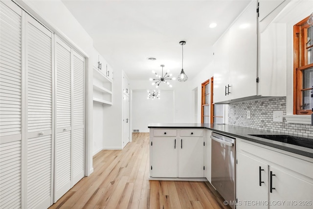 kitchen with backsplash, dishwasher, light wood-type flooring, and white cabinets