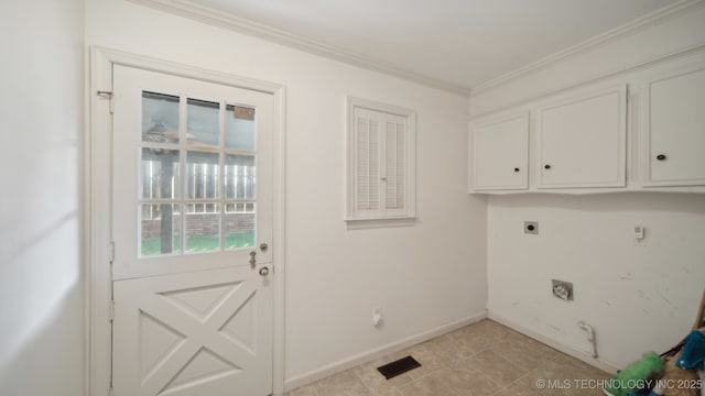 washroom featuring crown molding, cabinets, hookup for an electric dryer, and light tile patterned flooring