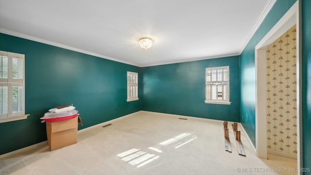 carpeted empty room featuring ornamental molding