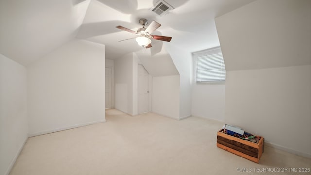 additional living space with lofted ceiling, light carpet, and ceiling fan