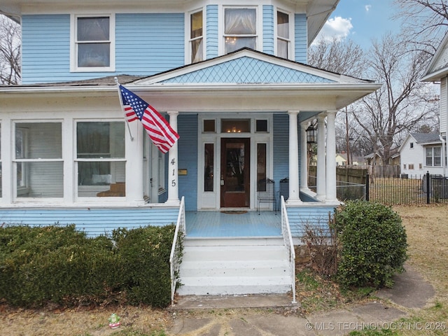 entrance to property featuring covered porch