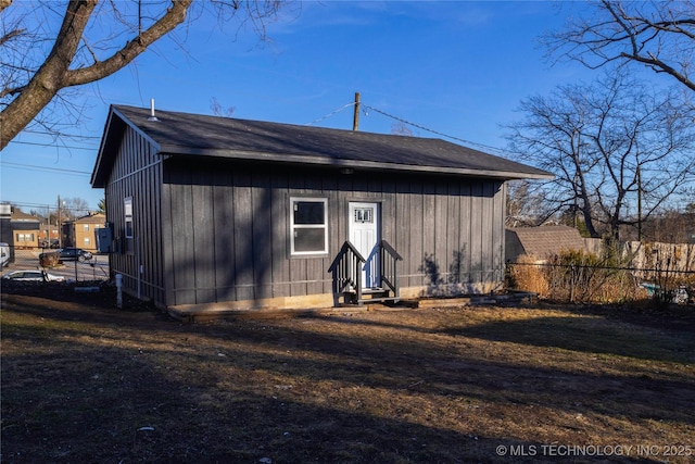 exterior space featuring entry steps and fence