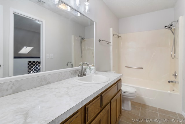 full bathroom with tile patterned floors, toilet, shower / washtub combination, and vanity