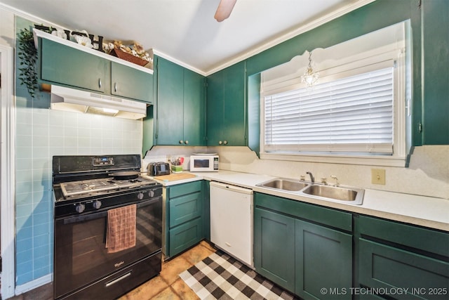 kitchen featuring white appliances, sink, decorative backsplash, and green cabinetry