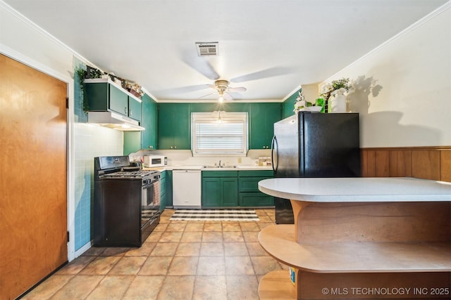 kitchen featuring sink, crown molding, green cabinets, ceiling fan, and black appliances