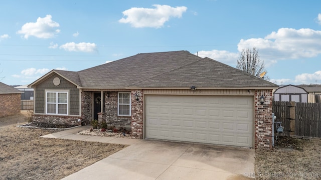 single story home with brick siding, a shingled roof, fence, a garage, and driveway