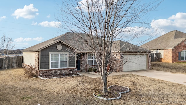 single story home featuring a garage, a front yard, concrete driveway, and fence