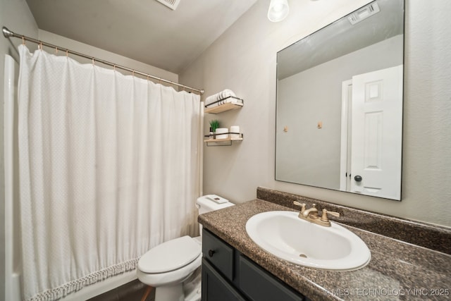 full bath featuring toilet, visible vents, and vanity