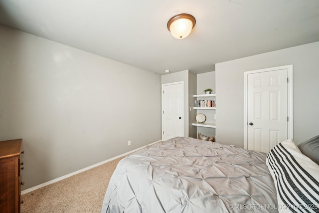 carpeted bedroom with baseboards