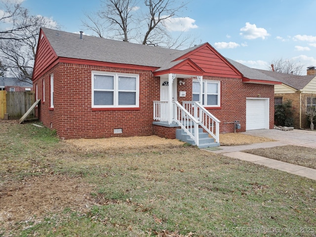 view of front of property featuring a garage and a front yard