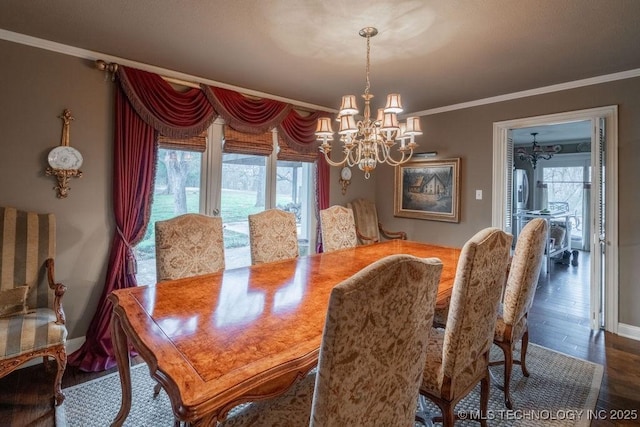 dining room featuring ornamental molding, a chandelier, and a healthy amount of sunlight
