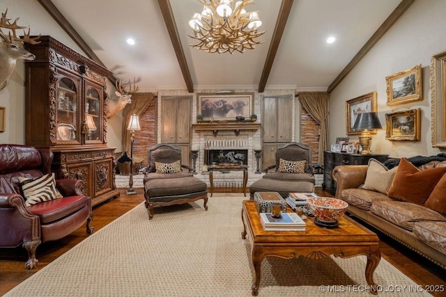 living area featuring a chandelier, a fireplace, beam ceiling, and wood finished floors