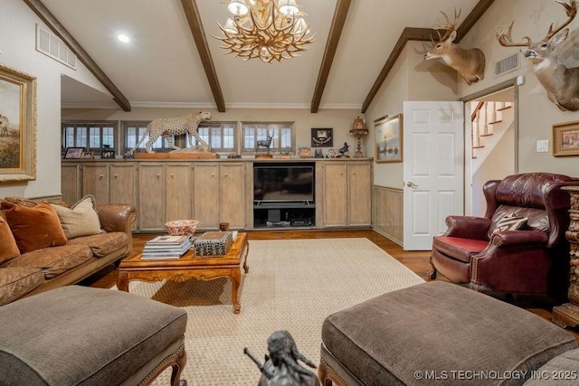 living room with a notable chandelier, visible vents, vaulted ceiling with beams, and light wood-style flooring