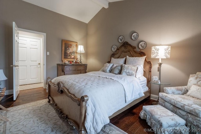 bedroom with wood finished floors, baseboards, and vaulted ceiling with beams