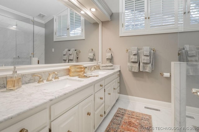 full bathroom with a sink, a marble finish shower, double vanity, and crown molding