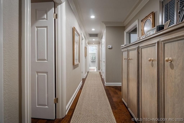 hall with visible vents, baseboards, dark wood-style floors, crown molding, and recessed lighting