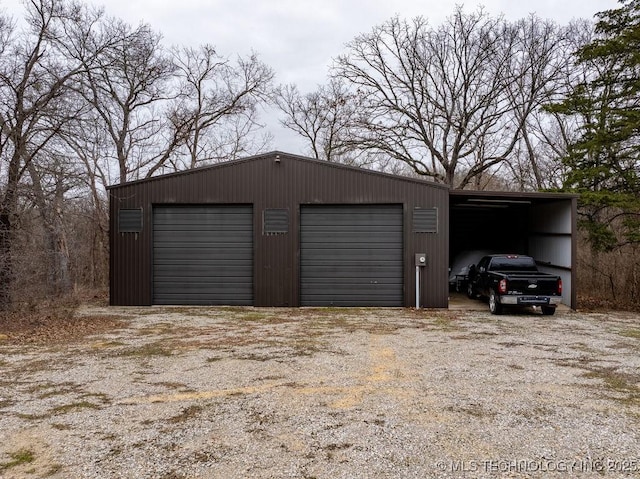 garage featuring a garage and driveway