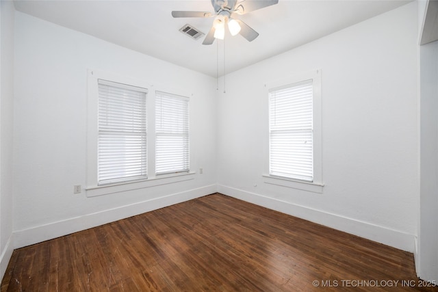 unfurnished room featuring ceiling fan, a healthy amount of sunlight, and dark hardwood / wood-style flooring