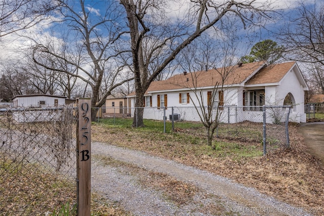 ranch-style house featuring central air condition unit