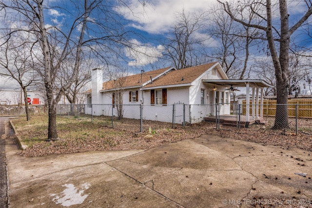 view of side of home featuring ceiling fan