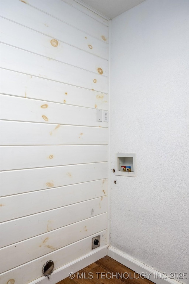 clothes washing area featuring dark wood-type flooring and hookup for a washing machine