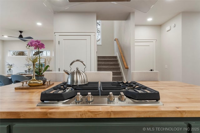 kitchen featuring recessed lighting, stainless steel gas cooktop, ceiling fan, and butcher block counters