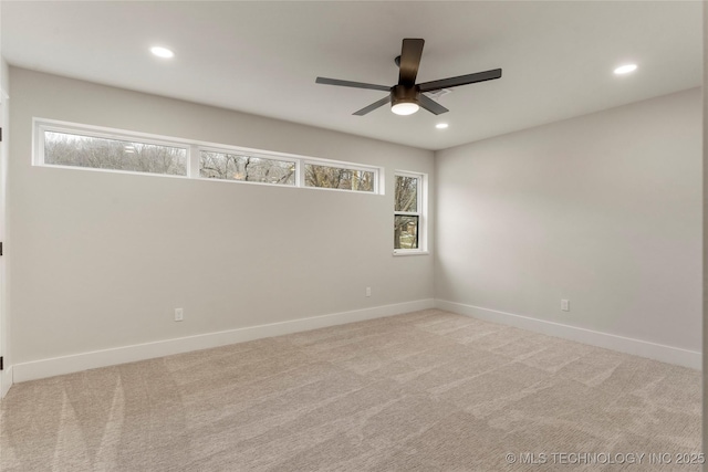 carpeted spare room with baseboards, recessed lighting, and a ceiling fan