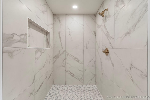 full bathroom with a tile shower