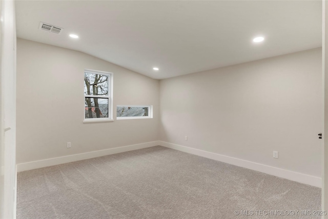 spare room featuring visible vents, recessed lighting, and baseboards