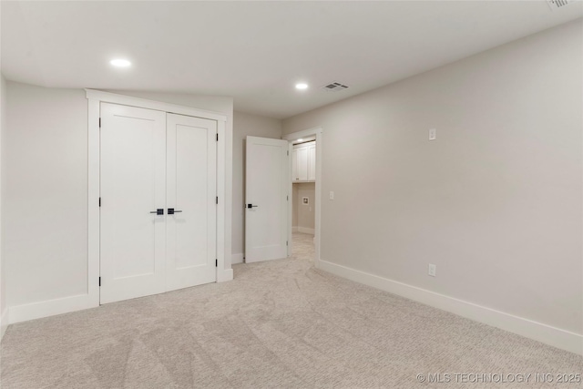 unfurnished bedroom with baseboards, visible vents, and recessed lighting