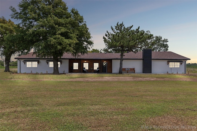 view of front of home with a lawn